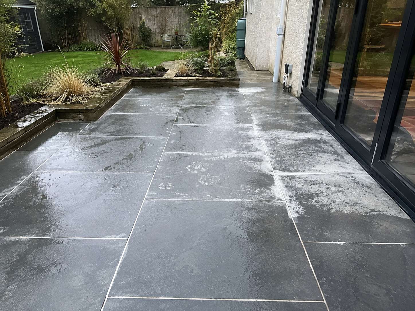 The White Crust: Why Your New Porcelain Patio Looks 20 Years Old